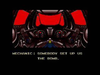 A screenshot from the 1989 video game "Zero Wing." The screen depicts the bridge of a spaceship and the words "MECHANIC: SOMEBODY SET US UP THE BOMB" 