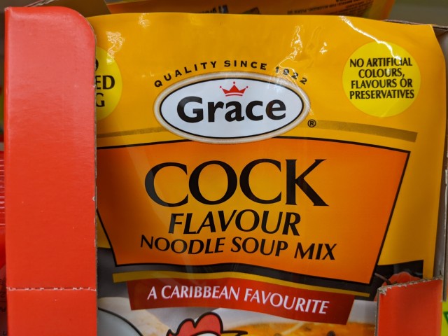 A packet of chicken soup mix, the label of which reads: "COCK FLAVOUR noodle soup mix -- a caribbean favourite"