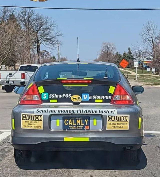 Photo of  a car rear bumper covered with signage indicating their willingness to drive faster if you send them mone though venmo or cashapp.  Signs include Caution this vehicle makes frequent stops, Caution slow moving vehicle, send me money, I'll drive faster.  vanity plate reads CALMLY.  venmo and cashapp handles are slow pos.